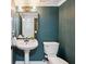 Elegant powder room with stylish fixtures and bold wallpaper at 1161 Monaco Dr, Mount Pleasant, SC 29464