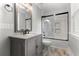 Bathroom featuring a granite-topped vanity, framed mirror, and black-framed tiled shower over tub at 1211 Dennis Blvd, Moncks Corner, SC 29461