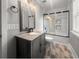 Modern bathroom with granite vanity, updated sink fixture, and glass-enclosed tile shower at 1211 Dennis Blvd, Moncks Corner, SC 29461