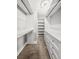 Walk-in closet with custom white shelves and drawers, providing ample storage space at 1211 Dennis Blvd, Moncks Corner, SC 29461