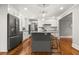 Updated kitchen features a large island, stainless steel appliances, and hardwood floors at 1211 Dennis Blvd, Moncks Corner, SC 29461