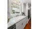 Bright and functional kitchen with white cabinets, granite countertops, and a view to the backyard at 1211 Dennis Blvd, Moncks Corner, SC 29461
