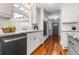 Updated kitchen with white cabinets, granite counters, stainless steel appliances, and a view to the backyard at 1211 Dennis Blvd, Moncks Corner, SC 29461