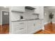 Stylish kitchen with white cabinets, stainless steel hardware, granite countertops, and subway tile backsplash at 1211 Dennis Blvd, Moncks Corner, SC 29461
