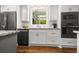 Bright white kitchen features stainless steel appliances, granite countertops, and white subway tile backsplash at 1211 Dennis Blvd, Moncks Corner, SC 29461