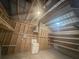 Unfinished storage room featuring wood framing, built-in shelving, and a utility sink at 1211 Dennis Blvd, Moncks Corner, SC 29461