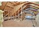 Unfinished attic space showcasing exposed wood framework and insulation at 125 Spring Meadows Dr, Summerville, SC 29485