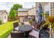 Backyard featuring an outdoor kitchen, complete with a built-in grill, table and a well-maintained lawn at 125 Spring Meadows Dr, Summerville, SC 29485