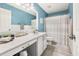 Stylish bathroom with a single vanity, blue walls, and a shower with patterned curtain at 125 Spring Meadows Dr, Summerville, SC 29485