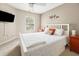 Bright bedroom featuring a plush bed with white headboard and warm-toned walls at 125 Spring Meadows Dr, Summerville, SC 29485
