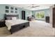 Comfortable bedroom with blue walls, ceiling fan, carpet flooring, and a cozy seating area by the window at 125 Spring Meadows Dr, Summerville, SC 29485