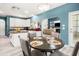 Eat-in kitchen leads to the dining room and features modern flooring, a fireplace, and a living space at 125 Spring Meadows Dr, Summerville, SC 29485