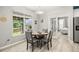 The dining room features a window with a view of the backyard and leads to the bedroom at 125 Spring Meadows Dr, Summerville, SC 29485