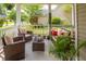 Inviting front porch with stylish outdoor furniture, hanging plants, and a serene atmosphere at 125 Spring Meadows Dr, Summerville, SC 29485