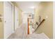Upstairs hallway featuring neutral walls, plush carpeting, and a view of the downstairs living area at 125 Spring Meadows Dr, Summerville, SC 29485