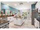 Open concept kitchen features white cabinets, stainless steel appliances, and flows into dining area at 125 Spring Meadows Dr, Summerville, SC 29485