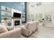 Bright living room features a fireplace, cathedral ceiling, and comfortable seating at 125 Spring Meadows Dr, Summerville, SC 29485