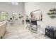 The living room includes light gray walls, modern flooring, and large windows, creating an airy atmosphere at 125 Spring Meadows Dr, Summerville, SC 29485