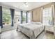 The bedroom is bright and features large windows with a view of the backyard and a ceiling fan at 125 Spring Meadows Dr, Summerville, SC 29485