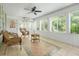 Inviting sunroom with wicker seating, tiled flooring, and large windows offering views of the backyard at 125 Spring Meadows Dr, Summerville, SC 29485