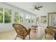 Bright sunroom featuring wicker furniture, tiled floors, and multiple windows overlooking the backyard at 125 Spring Meadows Dr, Summerville, SC 29485