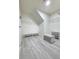 Spacious walk-in closet with wire shelving, laminate floors, bench, and shelves at 125 Spring Meadows Dr, Summerville, SC 29485