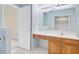 Cozy bathroom featuring tile floors, wood cabinets, and ample counter space for your morning routine at 1253 Horseshoe Bnd, Mount Pleasant, SC 29464