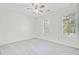 Spacious bedroom with neutral carpet, ceiling fan, and two bright windows at 1253 Horseshoe Bnd, Mount Pleasant, SC 29464