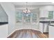 Bright dining area featuring laminate floors, a chandelier, and three windows offering lots of natural light at 1253 Horseshoe Bnd, Mount Pleasant, SC 29464