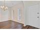 Dining room with hardwood floors, chandelier, and natural light from the windows at 1253 Horseshoe Bnd, Mount Pleasant, SC 29464