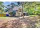 A view of the home's exterior featuring a screened porch, backyard, and established trees for shade at 1253 Horseshoe Bnd, Mount Pleasant, SC 29464
