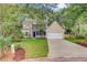Charming two-story home with a well-manicured lawn and curb appeal at 1253 Horseshoe Bnd, Mount Pleasant, SC 29464
