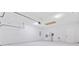 Spacious garage with white walls, multiple doors, a water heater, offering ample storage and parking at 1253 Horseshoe Bnd, Mount Pleasant, SC 29464