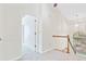 Upstairs hallway with carpeted floor, wood railing on the staircase, and lots of natural light at 1253 Horseshoe Bnd, Mount Pleasant, SC 29464