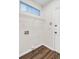 Functional laundry room with laminate flooring, overhead shelf and a utility sink connection, perfect for chores at 1253 Horseshoe Bnd, Mount Pleasant, SC 29464