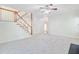 Large living room featuring plush carpet, fireplace, and stairs leading up at 1253 Horseshoe Bnd, Mount Pleasant, SC 29464