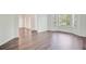 Bright living room featuring hardwood floors and multiple windows at 1253 Horseshoe Bnd, Mount Pleasant, SC 29464