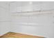 A walk-in pantry features laminated floors and built in wall shelving with cabinets overhead at 1253 Horseshoe Bnd, Mount Pleasant, SC 29464