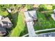 Aerial view of a home with a large green lawn and mature trees in a residential area at 126 Thousand Oaks Cir, Goose Creek, SC 29445