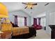 Spacious bedroom with a ceiling fan, ample natural light, and a cozy seating area at 126 Thousand Oaks Cir, Goose Creek, SC 29445