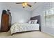 Comfortable bedroom featuring neutral tones, large window, and a ceiling fan at 126 Thousand Oaks Cir, Goose Creek, SC 29445