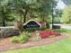 Welcoming entrance sign for 'The Preserve' with lush landscaping and manicured lawn at 126 Thousand Oaks Cir, Goose Creek, SC 29445