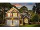 Charming two-story home featuring brick accents, neutral siding, and a well-manicured front lawn at 126 Thousand Oaks Cir, Goose Creek, SC 29445