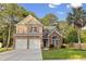 Two-story home with brick accents, red shutters, and a lush green lawn at 126 Thousand Oaks Cir, Goose Creek, SC 29445