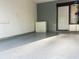 Spacious garage with an epoxy floor, chest freezer, and a door to the exterior or another room at 126 Thousand Oaks Cir, Goose Creek, SC 29445