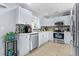 Bright kitchen with white cabinets, stainless steel appliances, and tile backsplash at 126 Thousand Oaks Cir, Goose Creek, SC 29445