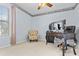 Well-lit home office with a large desk and comfortable seating at 126 Thousand Oaks Cir, Goose Creek, SC 29445