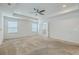 Large primary bedroom featuring trey ceiling, neutral carpet, and lots of natural light at 1350 Wild Goose Trl, Summerville, SC 29483