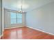 Bright dining room with a modern chandelier and large window providing natural light at 1350 Wild Goose Trl, Summerville, SC 29483