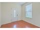 Bright foyer featuring hardwood floors, a decorative front door with glass, and a window at 1350 Wild Goose Trl, Summerville, SC 29483